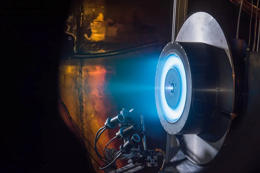 Electric Hall thruster firing blue plasma